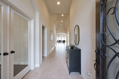 Step inside to discover beautiful tile floors, neutral paint, raised ceilings with elegant lighting and fans, arched doorways, fabulous natural light and so much more.