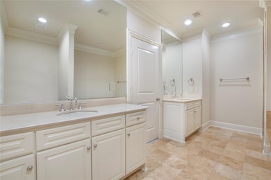 Bathroom featuring vanity and ornamental molding