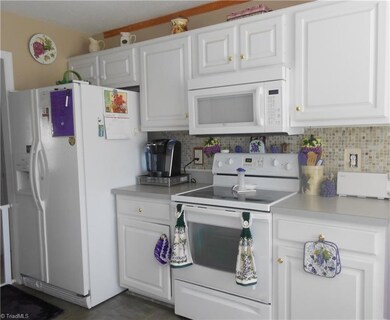 Updated back splash and refrigerator stays.