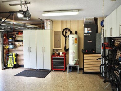 Raised water heater, plenty of light and great organization.