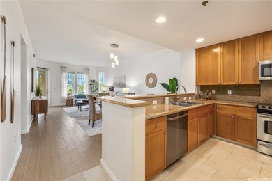The white stone flooring is carried through to the