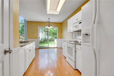 Spacious kitchen with laminate flooring