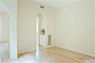 Dining room to kitchen. There is a pantry and a sh