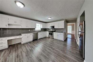 Kitchen with appliances with stainless steel finis