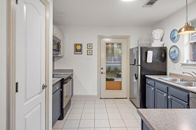 Additional view of kitchen with easy access to out