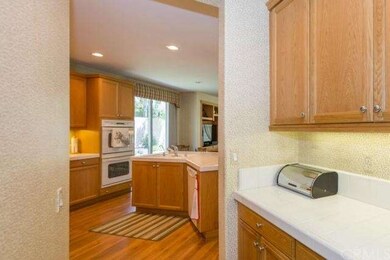 Butlers passage way with extra counter space and storage.