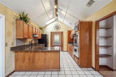 Large kitchen with granite countertops