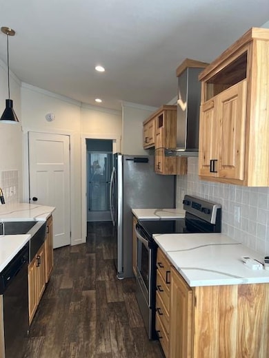 Kitchen with decorative backsplash, stove, ornamental molding, dark wood-style flooring, and dishwasher