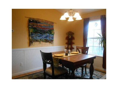 Dining Room. Wainscoting adds character to the dining room.  The window could easily become door to deck.