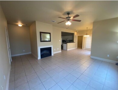 Spacious living and dining areas with tile floorin