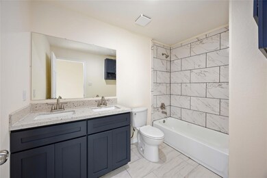 Granite Double sinks and a soaking tub with Shower? Yes, please! This secondary bathroom is a dream come true. So much space and style.- UNIT A