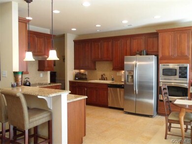 Gourmet kitchen with travertine tile flooring, gra