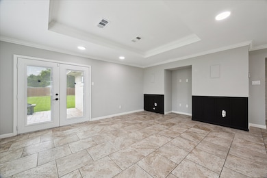 Bright living area with large tile flooring, neutr