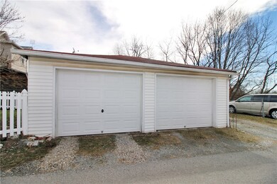 2 car detached garage, one bay is automatic, with