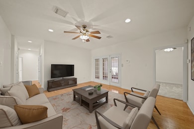 Features include recessed lighting, a ceiling fan