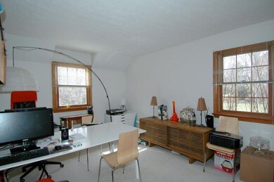 The den/office is located between the dining room 