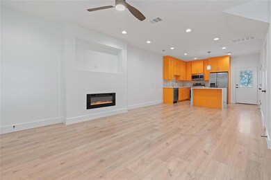 Kitchen featuring open floor plan, light countert