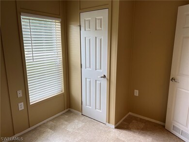 Unfurnished bedroom with light carpet