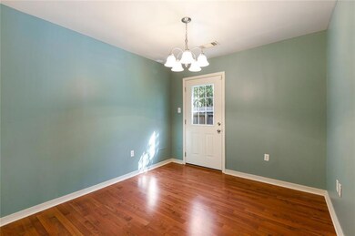 Ample Dining area with door to backyard