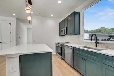 Kitchen featuring stainless steel appliances, a s