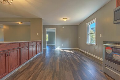 Interior space featuring dark wood-type flooring
