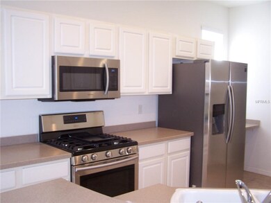 NEW stainless steel appliances and Corian counter 