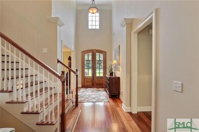 Well lit foyer entrance. Beautiful hardwood floors