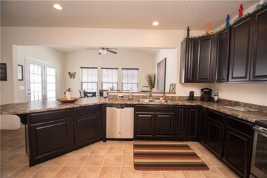 French doors lead to paved back patio.