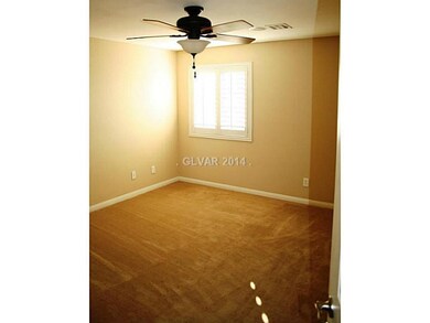 Bedroom. Guest Room with Carpeting and Shutters an