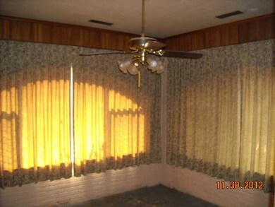 Glass enclosed porch with air ducks.
