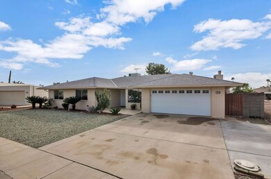 9719 W Campana Dr-large-002-25-Front Ext