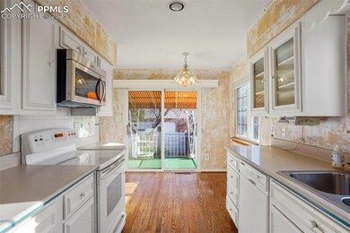 Kitchen with eat in area and walkout to rear cover