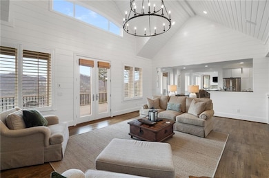 Living room featuring dark wood-style floors, an i