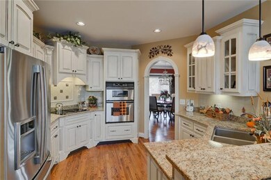 Custom glazed cabinets, granite, stainless steel appliances, large pantry, deep double sink