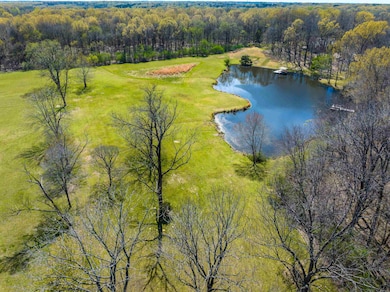 Drone / aerial view with a water view and a forest view