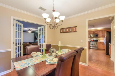 Another view of formal dining - stunning glass panel doors opens to rec room