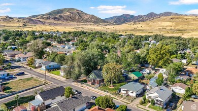 Aerial perspective of suburban area with a mountainous background
