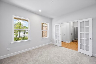 Unfurnished bedroom featuring french doors, carpet flooring, and recessed lighting