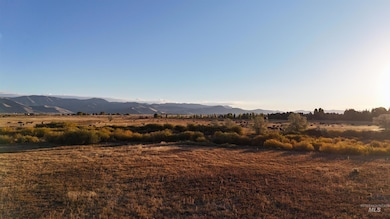 View of mountain background featuring rural landscape