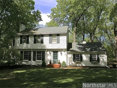 Expanded Classic Colonial in a beautiful 1+ acre s