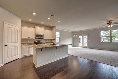Large island and pantry in this chef's kitchen!  All photos are of a similar home, not of actual property listed