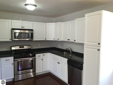 View of Counter Tops, Sink and Pantry.