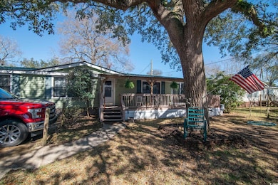 Back of house with a porch