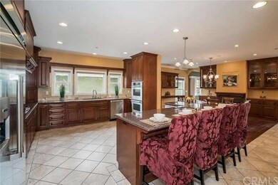 Gourmet kitchen with recessed lights and crown mol
