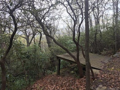 Platform built by seller on upper lot above rock o