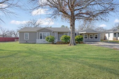 Ranch-style home featuring a front yard