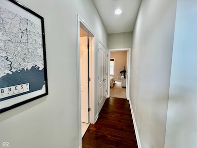 Hallway between bedrooms with full bath inbetween