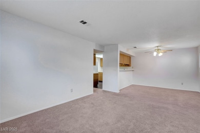 Unfurnished living room with light colored carpet