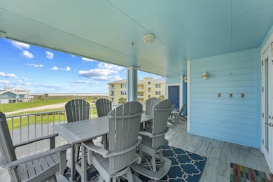 This spacious covered balcony offers peaceful view