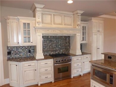 This kitchen truly has it all! It has a gas stove, gorgeous tile back-splash, and a pull out spice rack
